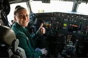 19 July 2023; Republic of Ireland's Lucy Quinn sits in the cockpit under the supervision of first officer Rupert Monahan at Sydney Airport, Australia, upon the team's arrival from their base in Brisbane, for their opening FIFA Women's World Cup 2023 group match against co-host Australia, on Thursday. Photo by Stephen McCarthy/Sportsfile