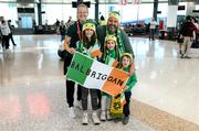 19 July 2023; Republic of Ireland's Diane Caldwell pose with the Prout family, from left, Isla, Maeve, dad Gerry and Oscar, who are living in Sydney, but originally from Balbriggan in Dublin, at Sydney Airport, Australia, upon the team's arrival from their base in Brisbane, for their opening FIFA Women's World Cup 2023 group match against co-host Australia, on Thursday. Photo by Stephen McCarthy/Sportsfile