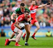 16 July 2023; Gareth McKinless of Derry is tackled by Sean O'Shea of Kerry during the GAA Football All-Ireland Senior Championship Semi-Final match between Derry and Kerry at Croke Park in Dublin. Photo by Brendan Moran/Sportsfile
