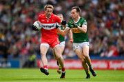 16 July 2023; Brendan Rogers of Derry is tackled by Jack Barry of Kerry during the GAA Football All-Ireland Senior Championship Semi-Final match between Derry and Kerry at Croke Park in Dublin. Photo by Brendan Moran/Sportsfile