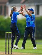 19 July 2023; Typhoons players including Alice Tector, left, and Georgia Atkinson, celebrate the wicket of Lara Maritz of Scorchers during the Evoke Super Series 2023 match between Typhoons and Scorchers at Pembroke Cricket Club in Dublin. Photo by Sam Barnes/Sportsfile