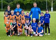 19 July 2023; Leinster players Luke McGrath, Scott Penny and coach Ava Gleeson with participants during a Bank of Ireland Leinster Rugby Summer Camp at Portlaoise RFC in Laois. Photo by Piaras Ó Mídheach/Sportsfile