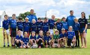 19 July 2023; Leinster players Scott Penny, left, and Luke McGrath and coach Saoirse Quinn with participants during a Bank of Ireland Leinster Rugby Summer Camp at Portlaoise RFC in Laois. Photo by Piaras Ó Mídheach/Sportsfile