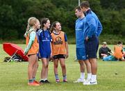 19 July 2023; Leinster players Luke McGrath and Scott Penny, right, with from left, Beth O'Regan, Aimee Conlan, Edel Ramsbottom and Emer Ramsbottom during a Bank of Ireland Leinster Rugby Summer Camp at Portlaoise RFC in Laois. Photo by Piaras Ó Mídheach/Sportsfile