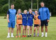 19 July 2023; Leinster players Luke McGrath, left, and Scott Penny, with from left, Beth O'Regan, Aimee Conlan, Edel Ramsbottom and Emer Ramsbottom during a Bank of Ireland Leinster Rugby Summer Camp at Portlaoise RFC in Laois. Photo by Piaras Ó Mídheach/Sportsfile