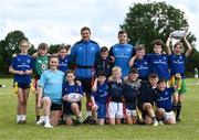 19 July 2023; Leinster players Scott Penny, left, and Luke McGrath with coach Katelynn Doran and participants during a Bank of Ireland Leinster Rugby Summer Camp at Portlaoise RFC in Laois. Photo by Piaras Ó Mídheach/Sportsfile