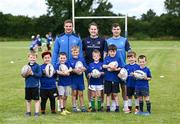 19 July 2023; Leinster players Scott Penny, left, and Luke McGrath with coach Bláthnaid Smith and participants during a Bank of Ireland Leinster Rugby Summer Camp at Portlaoise RFC in Laois. Photo by Piaras Ó Mídheach/Sportsfile