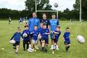 19 July 2023; Leinster players Scott Penny, left, and Luke McGrath with coach Bláthnaid Smith and participants during a Bank of Ireland Leinster Rugby Summer Camp at Portlaoise RFC in Laois. Photo by Piaras Ó Mídheach/Sportsfile