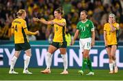 20 July 2023; Katie McCabe of Republic of Ireland reacts as Clare Hunt, right, and Clare Polkinghorne of Australia celebrate after the FIFA Women's World Cup 2023 Group B match between Australia and Republic of Ireland at Stadium Australia in Sydney, Australia. Photo by Stephen McCarthy/Sportsfile