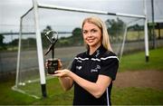 20 July 2023; PwC GPA Player of the Month for June in camogie, Caitrin Dobbin of Antrim, with her award at her local club Loughgiel Shamrocks GAA today. Photo by Ramsey Cardy/Sportsfile