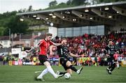 20 July 2023; Jamie McGonigle of Derry City shoots under pressure from Hordur Askham of HB during the UEFA Europa Conference League First Qualifying Round 2nd Leg match between Derry City and HB at the Ryan McBride Brandywell Stadium in Derry. Photo by Ramsey Cardy/Sportsfile