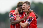 20 July 2023; Sadou Diallo of Derry City celebrates with Ronan Boyce, right, after scoring their side's first goal during the UEFA Europa Conference League First Qualifying Round 2nd Leg match between Derry City and HB at the Ryan McBride Brandywell Stadium in Derry. Photo by Ramsey Cardy/Sportsfile
