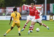 20 July 2023; Chris Forrester of St Patrick's Athletic in action against Yahcuroo Roemer of F91 Diddeleng during the UEFA Europa Conference League First Qualifying Round 2nd Leg match between St Patrick's Athletic and F91 Diddeleng at Richmond Park in Dublin. Photo by John Sheridan/Sportsfile