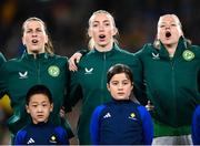 20 July 2023; Republic of Ireland players, from left, Niamh Fahey, Megan Connolly and Ruesha Littlejohn sing the national anthem before the FIFA Women's World Cup 2023 Group B match between Australia and Republic of Ireland at Stadium Australia in Sydney, Australia. Photo by Stephen McCarthy/Sportsfile