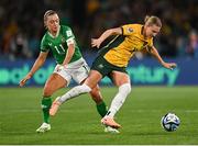 20 July 2023; Clare Hunt of Australia in action against Katie McCabe of Republic of Ireland during the FIFA Women's World Cup 2023 Group B match between Australia and Republic of Ireland at Stadium Australia in Sydney, Australia. Photo by Stephen McCarthy/Sportsfile