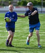 21 July 2023; Stephen Maxwell with Leinster coach Paul McGrath during a Leinster Rugby Inclusion Camp at Clontarf RFC in Dublin. Photo by Piaras Ó Mídheach/Sportsfile