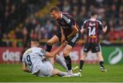 21 July 2023; Kacper Radkowski of Bohemians tussles with Sean Boyd of Shelbourne during the Sports Direct Men’s FAI Cup First Round match between Bohemians and Shelbourne at Dalymount Park in Dublin. Photo by Seb Daly/Sportsfile