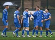 21 July 2023; Max Hutchinson of Finn Harps, second from right, is congratulated by teammates after scoring their side's first goal during the Sports Direct Men’s FAI Cup First Round match between Kilbarrack United and Finn Harps at White Heart Lane in Kilbarrack, Dublin. Photo by David Fitzgerald/Sportsfile
