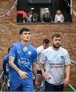 21 July 2023; Patrick Ferry of Finn Harps and Mark Townley of Kilbarrack United walk out before the Sports Direct Men’s FAI Cup First Round match between Kilbarrack United and Finn Harps at White Heart Lane in Kilbarrack, Dublin. Photo by David Fitzgerald/Sportsfile