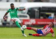 22 July 2023; Tunde Owolabi of Cork City is tackled by Lee Devitt of Treaty United during the Sports Direct Men’s FAI Cup First Round match between Treaty United and Cork City at Markets Field in Limerick. Photo by Michael P Ryan/Sportsfile