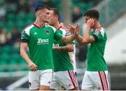 z1i22 July 2023; Joshua Honohan of Cork City, left, is congratulated by teammate Barry Coffey after he scored his sides first goal during the Sports Direct Men’s FAI Cup First Round match between Treaty United and Cork City at Markets Field in Limerick. Photo by Michael P Ryan/Sportsfile
