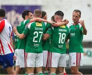 22 July 2023; Joshua Honohan of Cork City, 18, is congratulated by team-mates after scoring his sides first goal during the Sports Direct Men’s FAI Cup First Round match between Treaty United and Cork City at Markets Field in Limerick. Photo by Michael P Ryan/Sportsfile