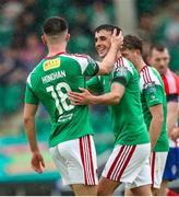 z1i22 July 2023; Joshua Honohan of Cork City, left, is congratulated by teammate Barry Coffey after he scored his sides first goal during the Sports Direct Men’s FAI Cup First Round match between Treaty United and Cork City at Markets Field in Limerick. Photo by Michael P Ryan/Sportsfile