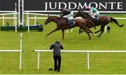 22 July 2023; Savethelastdance, left, with Ryan Moore up, on their way to winning the Juddmonte Irish Oaks, from second place Bluestocking, left, with Colin Keane up, during day one of the Juddmonte Irish Oaks Weekend at The Curragh Racecourse in Kildare. Photo by Seb Daly/Sportsfile