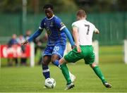 22 July 2023; Roland Idowu of Waterford in action against Jimmy Carr of St. Michael’s during the Sports Direct Men’s FAI Cup First Round match between St. Michael’s and Waterford at Cooke Park in Tipperary. Photo by Michael P Ryan/Sportsfile