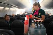 23 July 2023; Republic of Ireland's flight attendant Ruesha Littlejohn attends to masseuse Hannah Tobin Jones during their flight from their base in Brisbane to Perth for their FIFA Women's World Cup 2023 group match against Canada, on Wednesday. Photo by Stephen McCarthy/Sportsfile