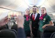 23 July 2023; Republic of Ireland's flight attendants Lucy Quinn and Ruesha Littlejohn, right, with Qantas cabin manager Paulo Guerreiro during their flight from their base in Brisbane to Perth for their FIFA Women's World Cup 2023 group match against Canada, on Wednesday. Photo by Stephen McCarthy/Sportsfile
