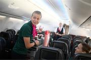 23 July 2023; Republic of Ireland's flight attendant Ruesha Littlejohn attends to Harriet Scott during their flight from their base in Brisbane to Perth for their FIFA Women's World Cup 2023 group match against Canada, on Wednesday. Photo by Stephen McCarthy/Sportsfile