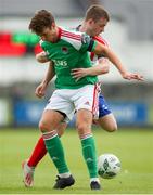 22 July 2023; Rokas Stanulevicius of Cork City in action against William Armshaw of Treaty United during the Sports Direct Men’s FAI Cup First Round match between Treaty United and Cork City at Markets Field in Limerick. Photo by Michael P Ryan/Sportsfile