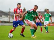 22 July 2023; Ally Gilcrist of Cork City in action against Ben O'Riordan of Treaty United during the Sports Direct Men’s FAI Cup First Round match between Treaty United and Cork City at Markets Field in Limerick. Photo by Michael P Ryan/Sportsfile