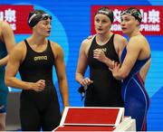 23 July 2023; Ireland relay 3, from left, Mona McSharry, Danielle Hill and Erin Riordan, watch teammate Victoria Catterson in the Women’s 400m Relay during day during day nine of the 2023 World Aquatics Championships at Marine Messe Fukuoka Hall A in Fukuoka, Japan. Photo by Ian MacNicol/Sportsfile
