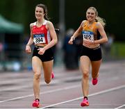 23 July 2023; Gemma Galvin of Ennis Track A.C., Clare, left, and Jennifer O Leary of Nenagh Olympic A.C., Tipperary, competes in the girl's under 17 1500m during day three of the 123.ie National Juvenile Track and Field Championships at Tullamore Harriers Stadium in Offaly. Photo by Stephen Marken/Sportsfile