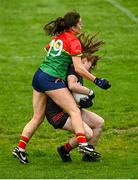 23 July 2023; Down goalkeeper Amy McGivern is tackled by Caoimhe Jordan of Carlow during the TG4 LGFA All-Ireland Junior Championship semi-final match between Down and Carlow at Parnell Park in Dublin. Photo by Eóin Noonan/Sportsfile