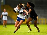 23 July 2023; Aisling Reidy of Clare is tackled by Lara Dahunsi of Antrim during the TG4 LGFA All-Ireland Intermediate Championship semi-final match between Antrim and Clare at Glennon Brothers Pearse Park, Longford. Photo by Tom Beary/Sportsfile