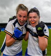 23 July 2023; Chloe Moloney, left, and Laurie Ryan of Clare celebrate their side’s victory after the TG4 LGFA All-Ireland Intermediate Championship semi-final match between Antrim and Clare at Glennon Brothers Pearse Park, Longford. Photo by Tom Beary/Sportsfile