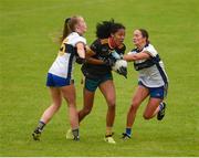 23 July 2023; Lara Dahunsi of Antrim is tackled by Caoimhe Cahill, left, and Louise Griffin of Clare during the TG4 LGFA All-Ireland Intermediate Championship semi-final match between Antrim and Clare at Glennon Brothers Pearse Park, Longford. Photo by Tom Beary/Sportsfile