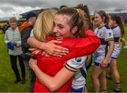 23 July 2023; Caoimhe Ryan of Clare celebrates her side’s victory with a supporter after the TG4 LGFA All-Ireland Intermediate Championship semi-final match between Antrim and Clare at Glennon Brothers Pearse Park, Longford. Photo by Tom Beary/Sportsfile
