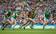23 July 2023; Eoin Cody of Kilkenny breaks away from Limerick players during the GAA Hurling All-Ireland Senior Championship final match between Kilkenny and Limerick at Croke Park in Dublin. Photo by David Fitzgerald/Sportsfile