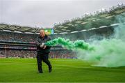 23 July 2023; A flare is removed from the pitch during the GAA Hurling All-Ireland Senior Championship final match between Kilkenny and Limerick at Croke Park in Dublin. Photo by Ray McManus/Sportsfile