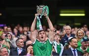 23 July 2023; Barry Nash of Limerick lifts the Liam MacCarthy Cup after the GAA Hurling All-Ireland Senior Championship final match between Kilkenny and Limerick at Croke Park in Dublin. Photo by Ramsey Cardy/Sportsfile