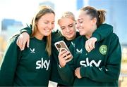 24 July 2023; Republic of Ireland players, from left, Kyra Carusa, Izzy Atkinson and Abbie Larkin review their TikTok dance recording at the Elizabeth Quay Bridge in Perth, Australia, ahead of their second Group B match of the FIFA Women's World Cup 2023, against Canada. Photo by Stephen McCarthy/Sportsfile