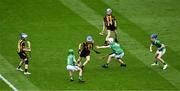 23 July 2023; James Walsh, St Laurence's NS, Kilmacud, Ath Cliath, representing Kilkenny in action against Cian Loughnane, Lurga NS, Gort, Galway, during the INTO Cumann na mBunscol GAA Respect Exhibition Go Games at the GAA Hurling All-Ireland Senior Championship final match between Kilkenny and Limerick at Croke Park in Dublin. Photo by Daire Brennan/Sportsfile