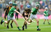 23 July 2023; James Walsh, St Laurence's NS, Blackrock, Ath Cliath, representing Kilkenny, in action against Paddy Cronin, Scoil Treasa Naofa, Trá Lí, Ciarrai, representing Limerick, left, and Cathal Murnane, Scoil Dean Cussen, Bruff, Limerick, representing Limerick, during the INTO Cumann na mBunscol GAA Respect Exhibition Go Games at the GAA Hurling All-Ireland Senior Championship final match between Kilkenny and Limerick at Croke Park in Dublin. Photo by Sam Barnes/Sportsfile