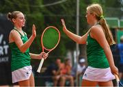 24 July 2023; Lydia Brennan of Ireland, left, and teammate Jennifer Marsh celebrate scoring a point while competing in the girls doubles round 1 against Augusta Lucia Grau Kristensen and Sophia Ragus of Denmark during day one of the 2023 Summer European Youth Olympic Festival at the Branik Tennis Club in Maribor, Slovenia. Photo by Tyler Miller/Sportsfile