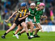 23 July 2023; Clodhna Ni Dhubhthaigh, Gaelscoil Thaobh a Coille, Ath Cliath, representing Kilkenny, in action against Kate Motherway, Bunscoil Bhothar na Naomh, Waterford, representing Limerick, during the INTO Cumann na mBunscol GAA Respect Exhibition Go Games at the GAA Hurling All-Ireland Senior Championship final match between Kilkenny and Limerick at Croke Park in Dublin. Photo by Brendan Moran/Sportsfile