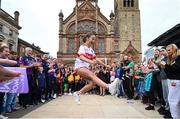 24 July 2023; Rachel McAuley dances in front of the Guildhall during the opening ceremony of the FRS Recruitment GAA World Games 2023 in Derry. Photo by Ramsey Cardy/Sportsfile